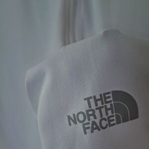 Northface half zip with a hoodie and thumb holes.